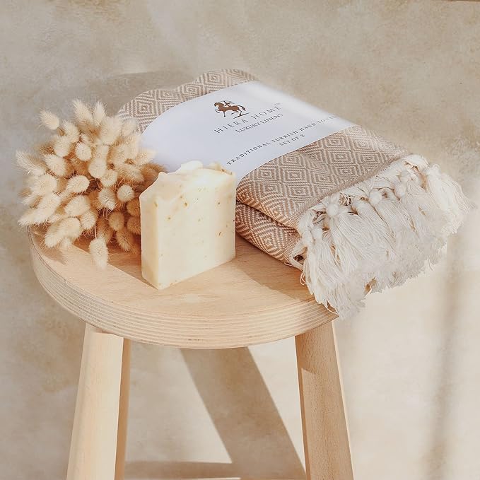 A turkish kitchen towel sitting on a stool.