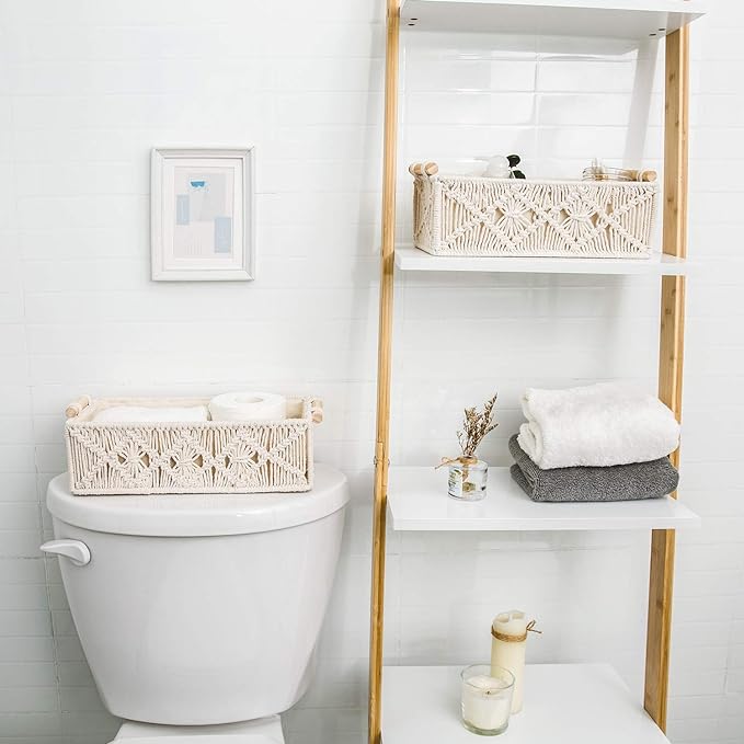 A bathroom with shelves, with cotton storage baskets on them.