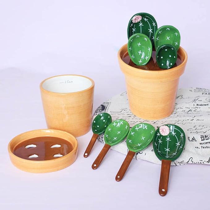 A set of cactus pots and spoons in purple background