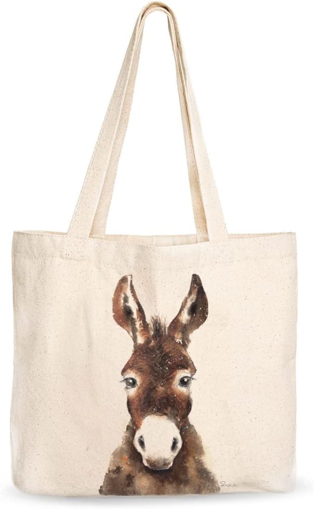 A canvas tote bag featuring a cute donkey face design, perfect for carrying essentials with a touch of whimsy.