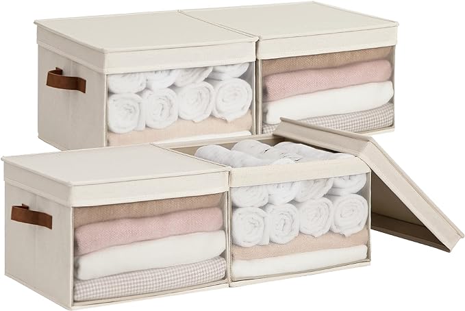 Four beige storage boxes with clothes in them.