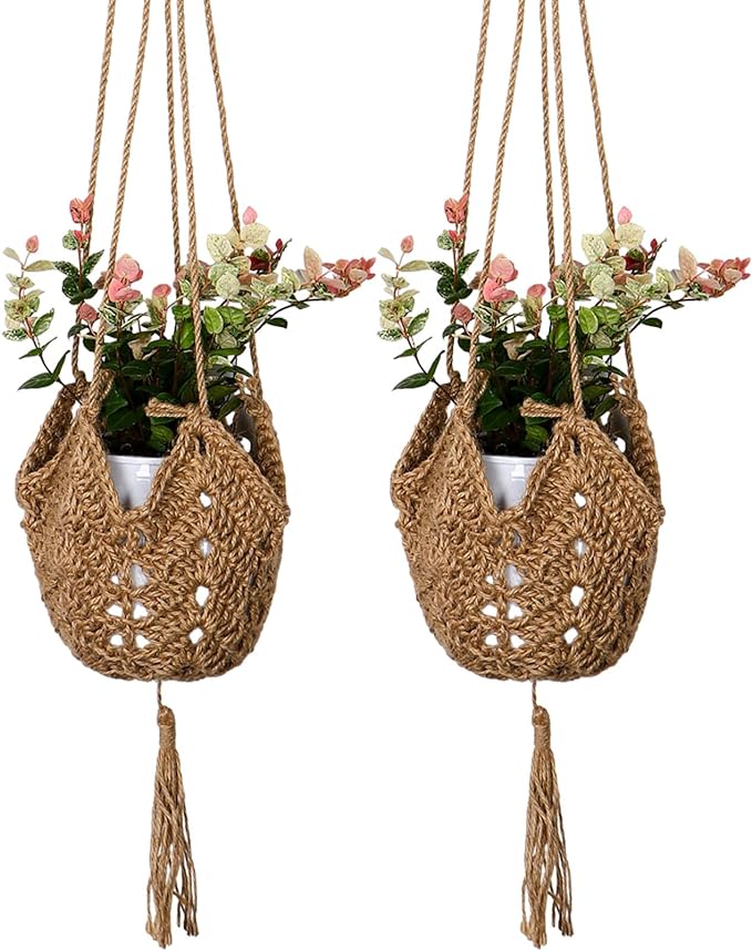 Two hanging boho designed planters with colorful flowers.