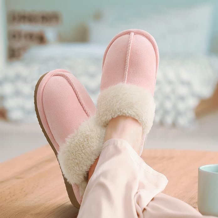 A woman in pajama wearing pink memory foam slippers with coffee