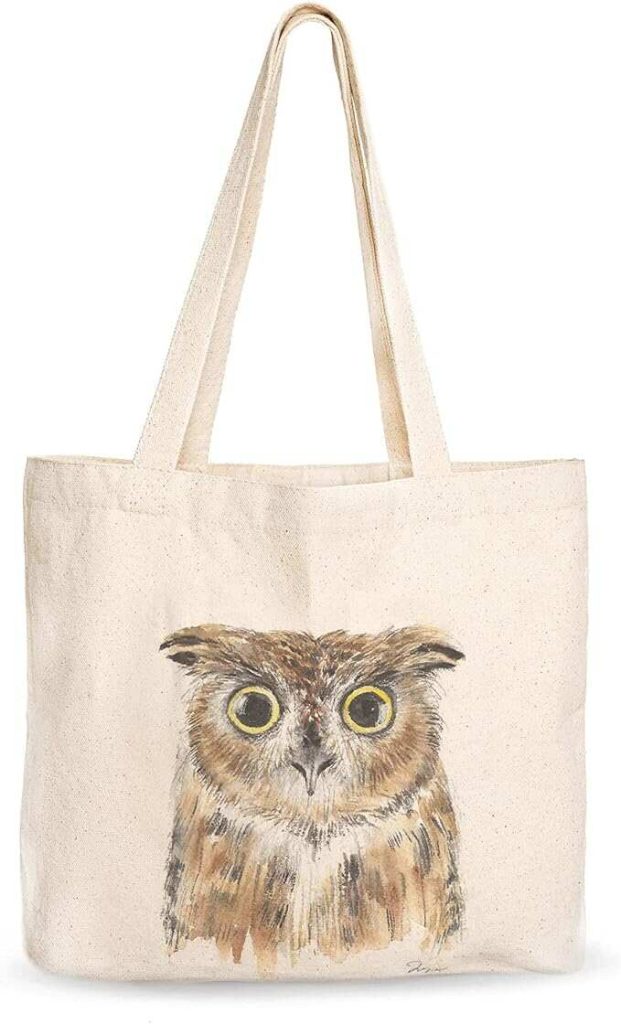 Watercolor painting of an owl on a canvas tote bag.