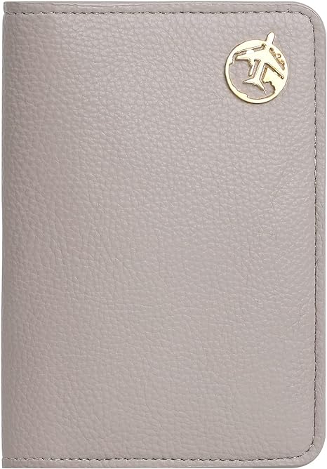 A grey leather passport holder with a gold airplane logo on it.