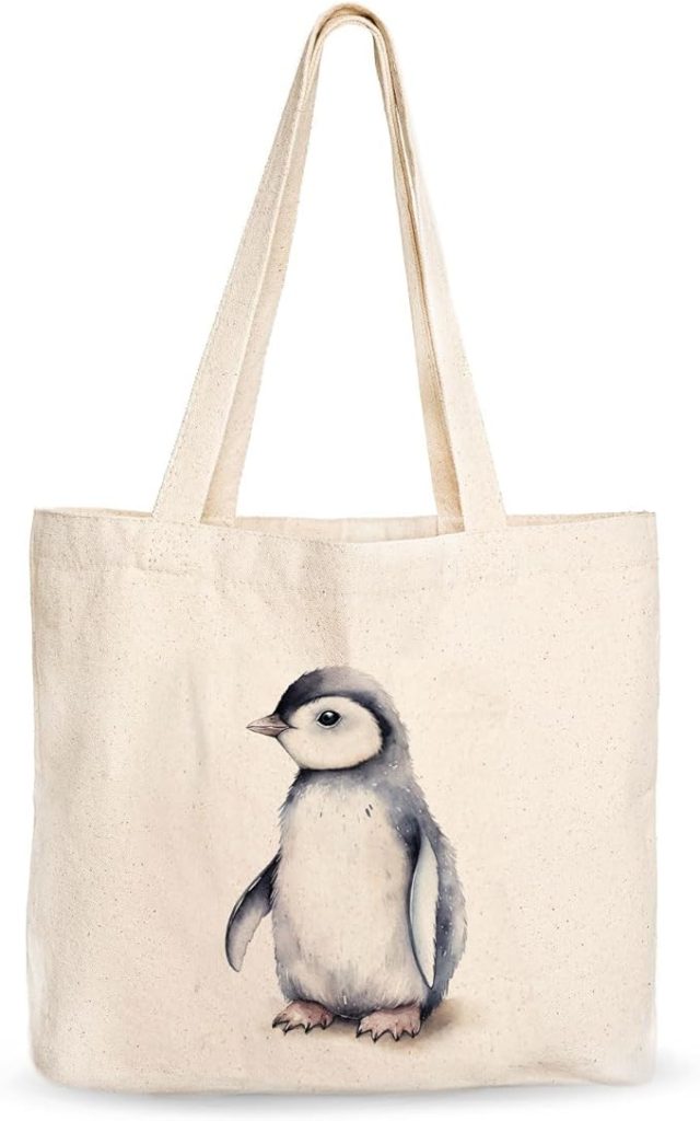 A canvas tote bag featuring a small penguin print.