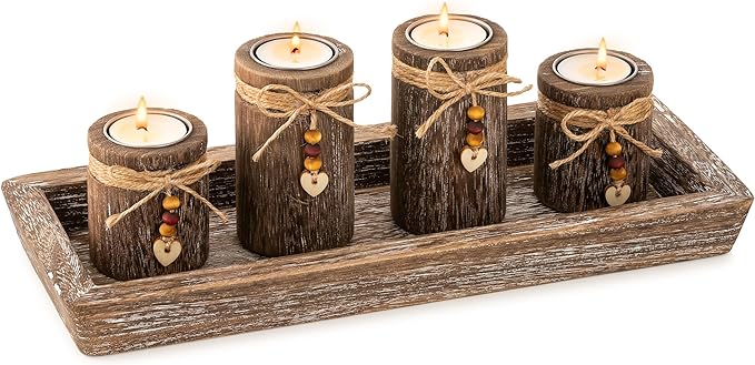 Four candles in a wooden tray with a heart-shaped laces