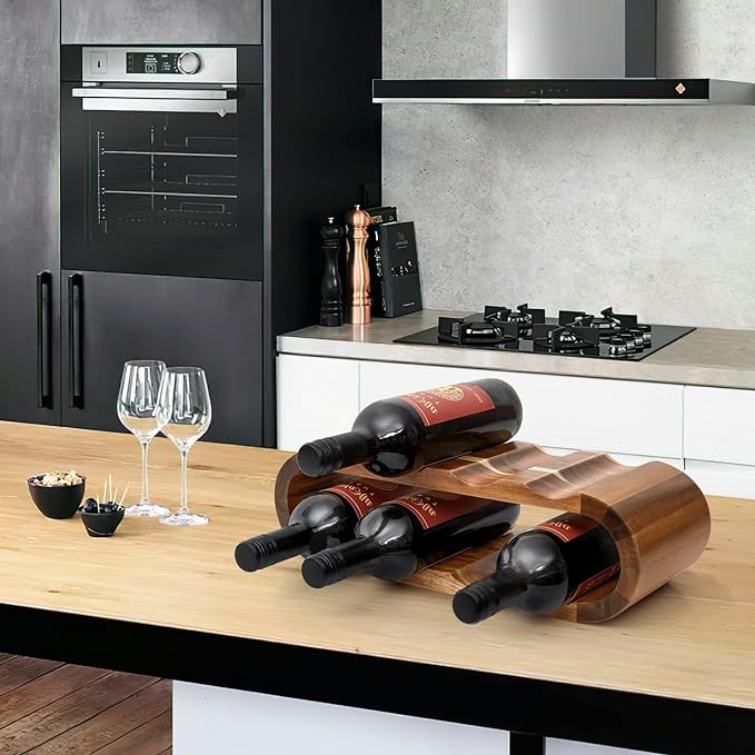 A wooden wine rack organizers displaying four bottles of wine.