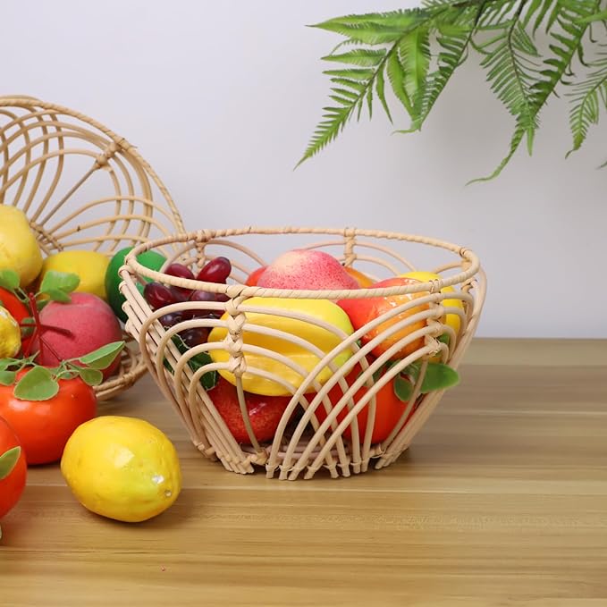 A variety of fresh fruits and vegetables displayed in a basket on a wooden table.